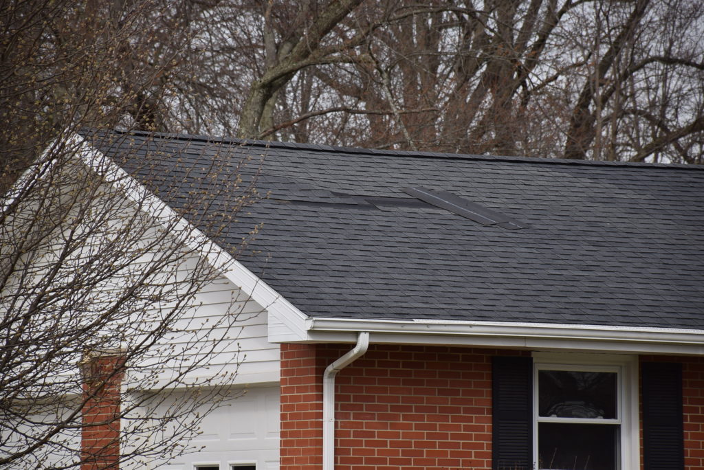 Here is an example of a home that has experienced some roof damage from recent high winds in Muncie. Photo by: Mike Rhodes