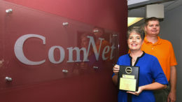 ComNet owners, Mindy and Tom Kemper are pictured with their 13th ATSI award. Photo by: Mike Rhodes