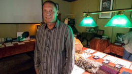 Derek Hilbert is pictured in front of items donated for "Tips for Turkeys" at the Fickle Peach. Photo by: Mike Rhodes