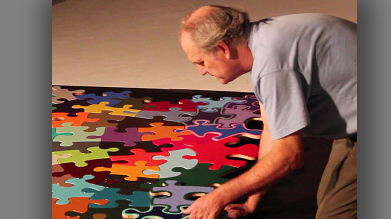 Artist Kevin Campbell is pictured with his "Puzzle Project." Photo provided.