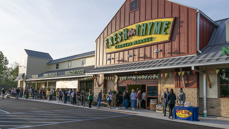 Early shoppers are pictured outside the new Fresh Thyme Farmers Market at 7am, May 17th. Photo by: Mike Rhodes