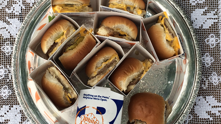 White Castle sliders fill a silver serving tray. Photo by: Nancy Carlson