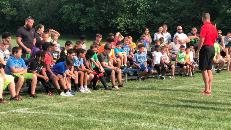 Ball State football coach Mike New addresses participants at the John Frank pre-season mini-camp. Photo provided.