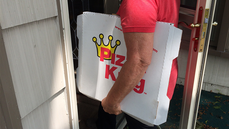 This is how not to carry a Pizza King pizza into your house. Photo by: John Carlson