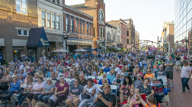 This crowd packed Walnut Street in downtown Muncie for the Voices (Re) United Concert. Photo by: Mike Rhodes