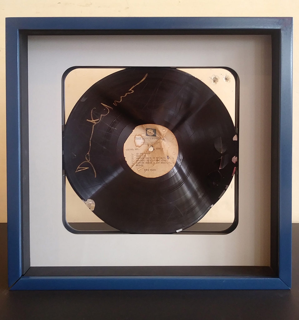 Side 1 master lacquer plate of Pink Floyd's "The Wall" signed by David Gilmour. Photo by: Mark Perretta