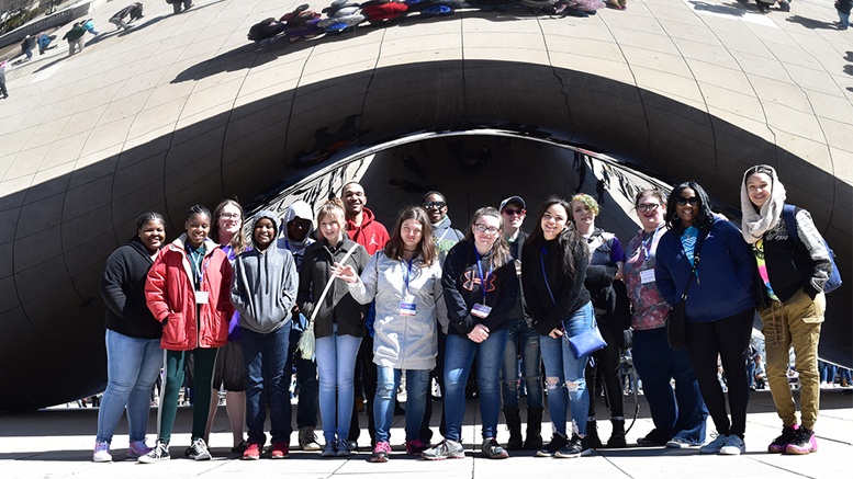 Upward Bound students and chaperones gather at “Cloud Gate” in Millennium Park during their Spring Break trip to Chicago. Photo provided