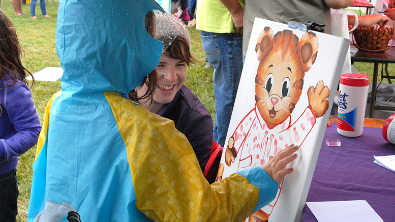 This Daniel Tiger painting was created at the Cornerstone Center for the Arts booth during the first Be My Neighbor Day in 2015. Kids painted Daniel’s sweater with their thumbprints. Photo provided