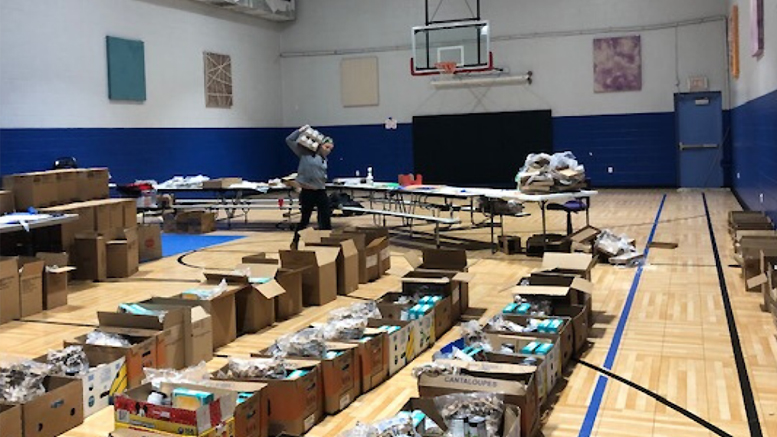 Ross Community Center continues to serve neighbors by modifying their weekly market to drive-through food distribution. Ross Community Center is a recipient of an Emergency Response Grant from The Community Foundation. Photo provided