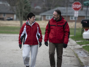 Kelly and Joel Shrock take a walk in their neighborhood.
