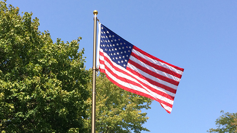 Our American flag waving under an azure sky is a beautiful sight indeed. Photo by Nancy Carlson