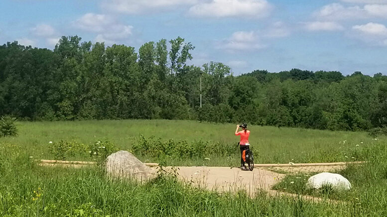A lone bike rider is pictured enjoying the view. Photo provided