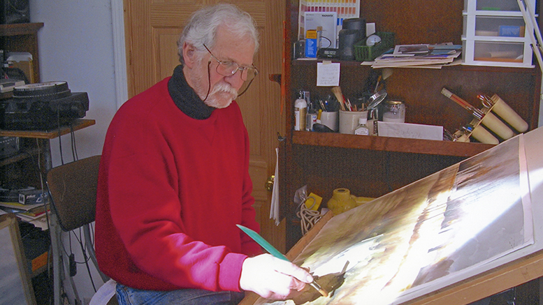 Jim Faulkner painting at his easel. Photo provided