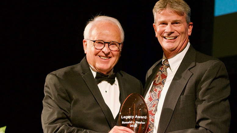 (L): Reverend Dr. Ronald Naylor is pictured receiving the award with (R): Terry Pence, Vice President of Operations for IU Health Ball Memorial Hospital and Chairman of the Muncie-Delaware County Chamber of Commerce Board of Directors. Photo by Matt Howell