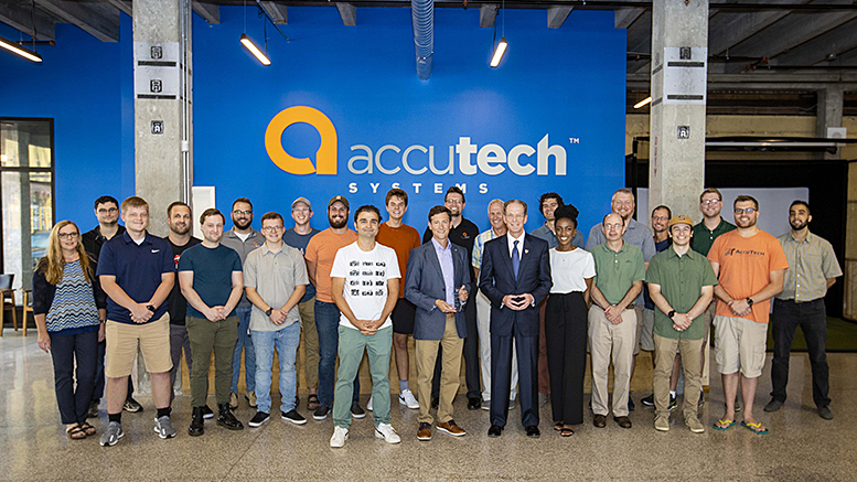 Ball State President Geoffrey S. Mearns (front row, fifth from right) presenting the 2021 Ball State University Community Partner of the Year Award to Accutech President Adam Unger (front row, sixth from right). Photo provided by Ball State University.