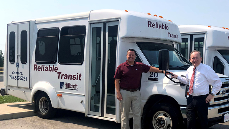 L-R: Dan Wolfert (Hillcroft Services) and Scott Watkins (Muncie Symphony Orchestra) stand in front of a Hillcroft Reliable Transit Van that will be used to help transport MSO attendees in need this upcoming season. Photo provided.