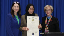 State Reps. Elizabeth Rowray (R-Yorktown) (left) and Sue Errington (D-Muncie) (right) present Bibi Bahrami (center) a resolution honoring the Muncie Afghan Refugee Resettlement Committee Wednesday, Feb. 16, 2022, at the Indiana Statehouse. The committee welcomed refugees from Afghanistan and assisted in resettling more than 50 families while connecting them with medical resources, education and job opportunities. Photo provided by Elizabeth Rowray.
