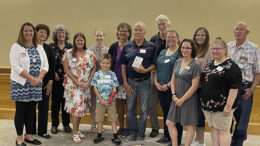 Blackford County volunteer Fred Hoffman (center) was recognized with the Healthy Community Alliance “100,00 Award” on June 13th at Minnetrista in Muncie. Several family members and fellow Blackford County volunteers and community advocates were present for the ceremony and are pictured as well. Hoffman was honored for his involvement with the creation of the Blackford Greenway and continued community support. Photo by John Disher.