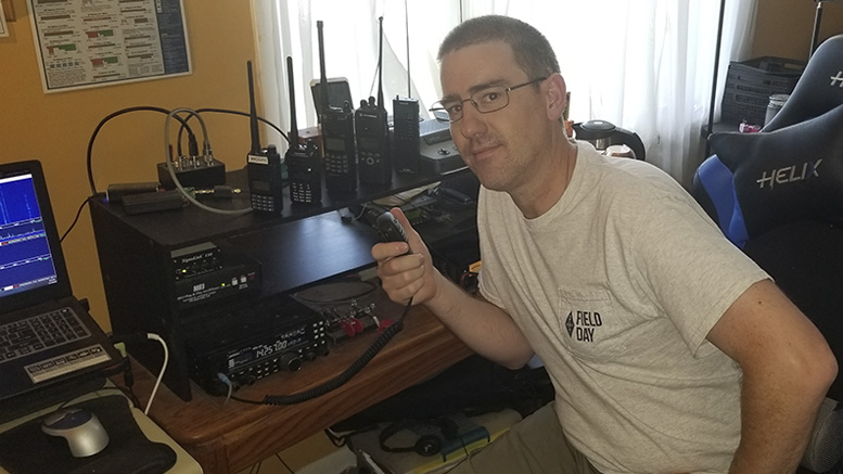 Drew Bennett, president of Muncie Area Amateur Radio Club as he attempts to make a contact from his Muncie station. Photo provided by Jim McDonald.