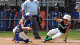 Delaney Boyd slides safely into home, scoring an early run in Team Indiana’s quick start against Team Michigan.