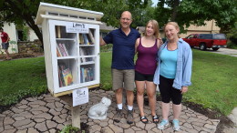 Craig, Anna and Elianor beside their new neighborhood "little free library."