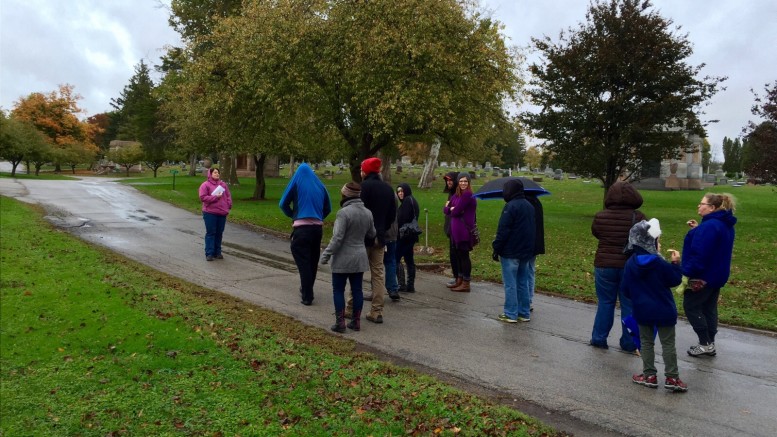 Nicole Rudnicki and Mike Mavis take visitors on guided tour of the cemetery.