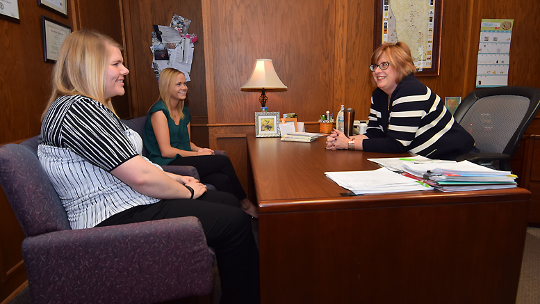 BBSU Human Resources students Jessica Benz and Emma Floit are pictured discussing HR trends with Dorothy Douglass, Vice President of Human Resources for MutualBank. Photo by: Mike Rhodes