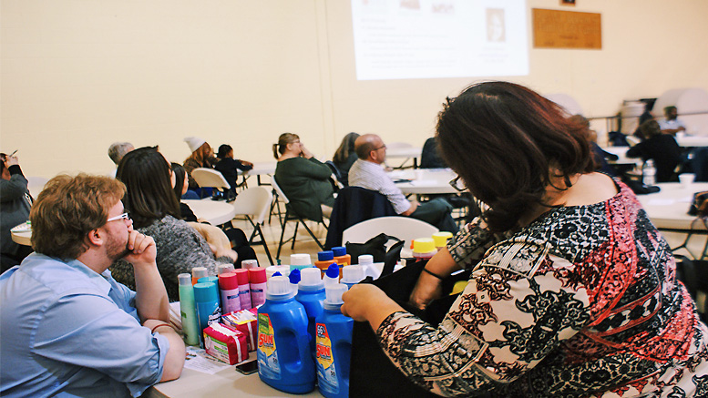 Volunteers are pictured giving away cleaning supplies for families in need. Photo by: Rebekah Gaillard