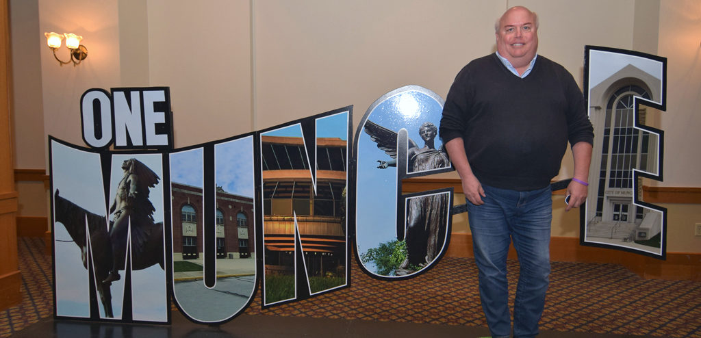 Charles Jamieson is photographed by the "One Muncie" sign at the Mayor's State of the City Address. Photo by: Mike Rhodes