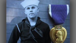 Gordon Carlson is pictured as a 17-year-old Navy recruit in 1943. Injured two years later in the battle for Okinawa, he earned a Purple Heart.