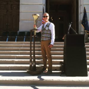 Dale Basham tries out the 4.5 lb. torch for the upcoming Torch Relay. Photo provided.