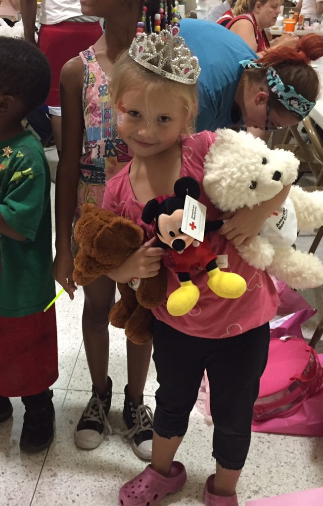 According to Mark Slusher, an American Red Cross volunteer, this little girl’s name is Pheonix. She lost her father prior to the tornado. Her home and the gifts for her birthday party were lost in the tornado. Red Cross workers donated money to buy cake and gifts to have a birthday party for Pheonix at the shelter she and her mother stayed in after losing their home. Photo by: Mark Slusher