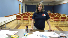 Mary Lou Gentis sets up supplies for "Color Me Calm," an adult coloring program. Photo by: Raven Brooks