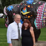 Mayor Dennis Tyler is pictured with Denise King, the artist who designed the Bison, now named "Neolin."