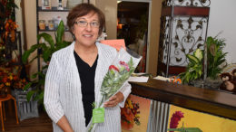 Sharon Grubbs with a Petal it Forward bouquet. 900 bouquets will be given away Wednesday October 11th. Photo by: Mike Rhodes