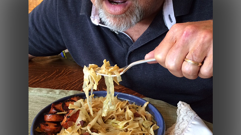 Here’s a demonstration of the crass way to hold a fork. Photo by: Nancy Carlson