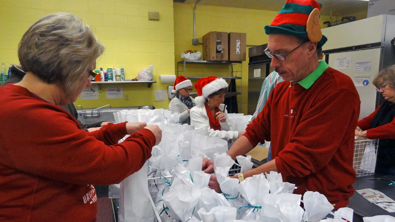 Some of Santa's helpers preparing food at last year's Christmas Breakfast at the Harvest Soup Kitchen. Photo provided.