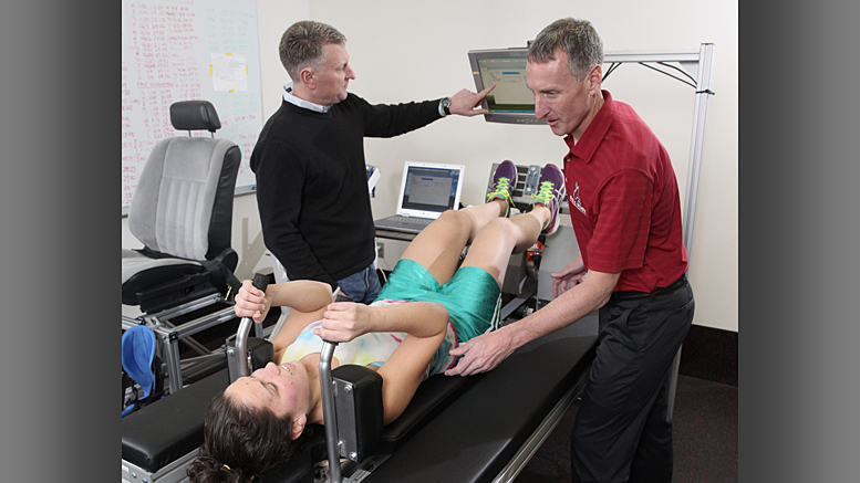 Todd Trappe (left) and Scott Trappe (right) work on a research project at Ball State’s Human Performance Laboratory. Photo provided.