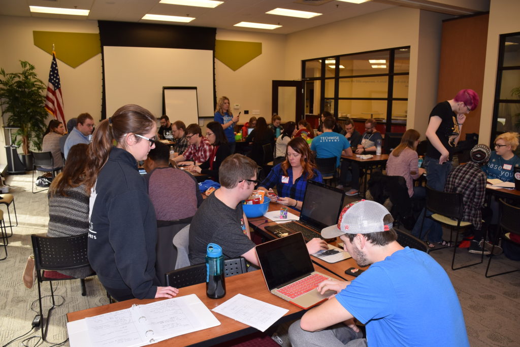 Six teams of volunteer web developers and members of local non-profits begin their work at the Innovation Connector. 