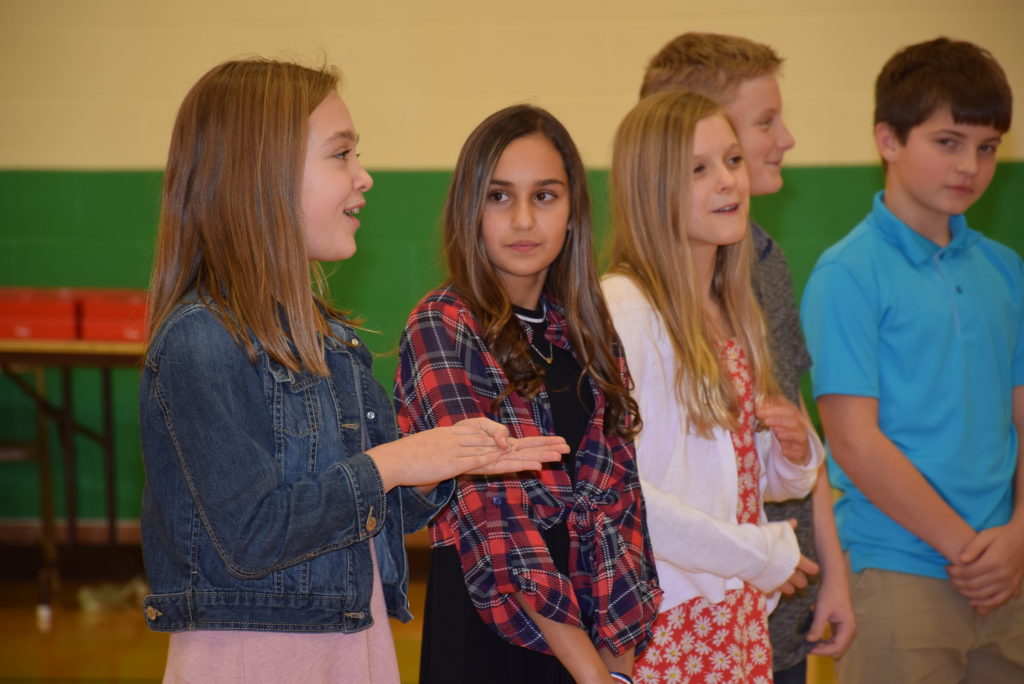 Allie Wilhelm (far left) tells her class about what their winning app was about. Photo by: Mike Rhodes