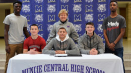 From left to right: Khamasi Muhiga, Riley Ray, Athletic Director Suzanne Crump (back center), Jamel Barnes (front center), Trenton Hatfield, and Quentin Thompson.