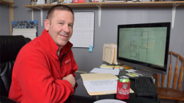 Jay Demaree is pictured in his office reviewing some recent project drawings. Photo by: Mike Rhodes