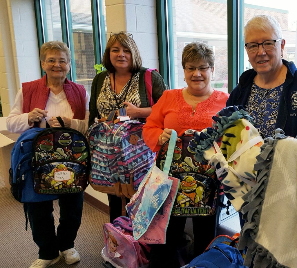 Altrusans deliver blankets and backpacks filled with toiletries and books to the local Department of Child Services. Photo courtesy of Sarah Rhoades.