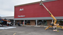 Signage installers and painters working at the new Art Van Furniture location in Muncie.