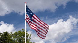 An American flag marks Memorial Day. By: Graphicstock