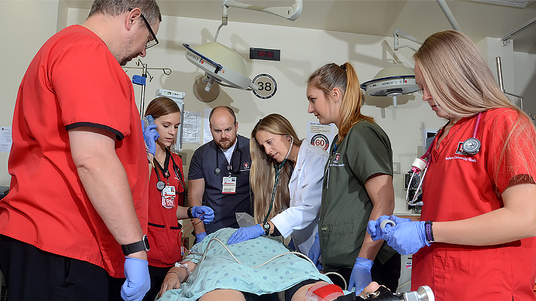 Dr. Kendal Baker and the Emergency Department team review trauma patient care. Photo courtesy of IU Health/Ball Memorial Hospital.