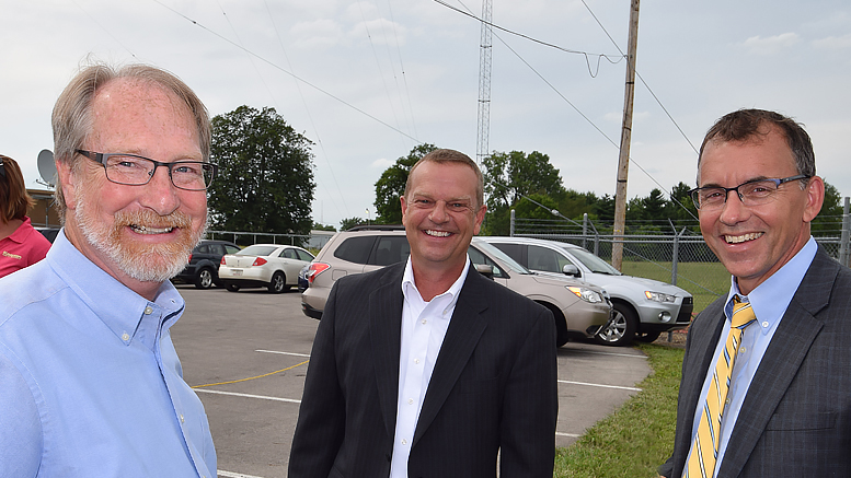 Jay Julian, Pat Botts and Chris Caldwell are pictured outside the offices of Woof Boom radio. Photo by: Mike Rhodes