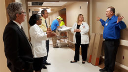 As the 9N Adult Surgical Unit remodel comes to a close, leaders take a tour and learn about the space and upgrades. From left to right: IU Health East Central Region President Dr. Jeff Bird, Administrative Director of Medical/Surgical Services Chanel Venable, IU Health Executive Vice President and Chief Operating Officer Al Gatmaitan, construction engineers in the background, Clinical Operations Manager Teresa Elliott, and Projects and Plant Operations Manager John Ward.