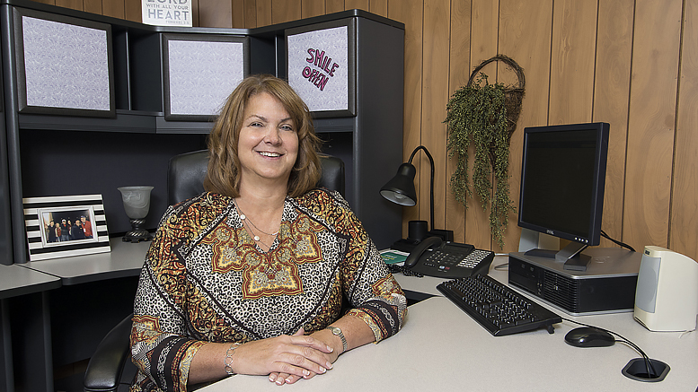 Sue Tschuor is pictured in her office at Woof Boom Radio, LLC. Photo by: Mike Rhodes