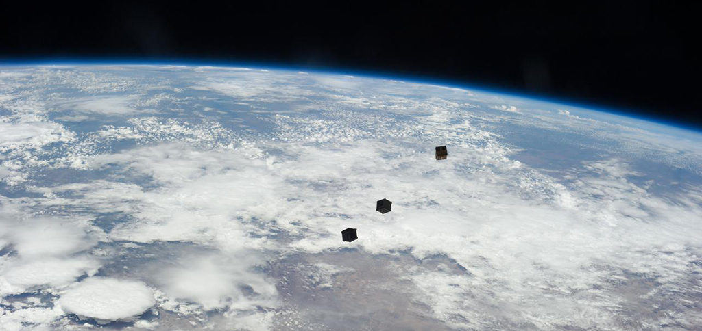 A view of three cube satellites after deployment. Photo courtesy of NASA.